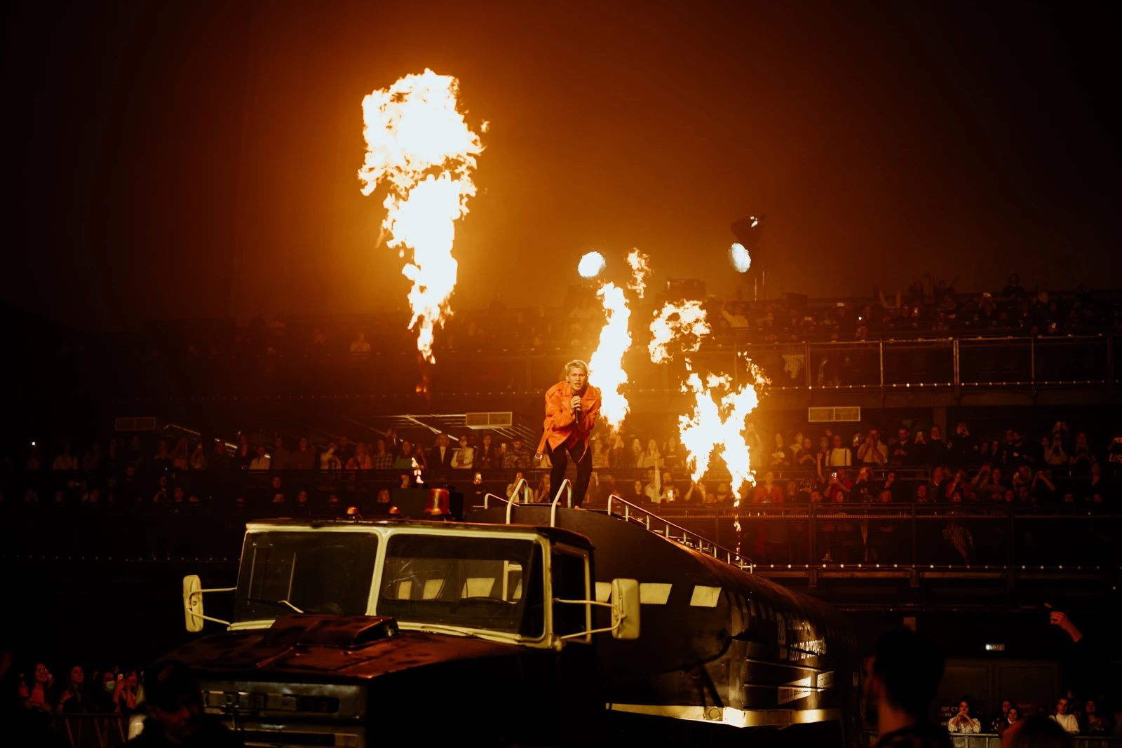 A performer on the fuel tanker surrounded by flames during the t.A.T.u. tribute